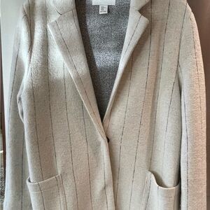 Stylish white with a slight black pinstripe coat